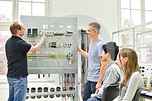Technical vocational training in industry: young apprentices and photo