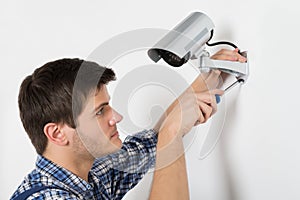 Technician Adjusting CCTV Camera