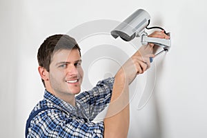 Technician Adjusting CCTV Camera