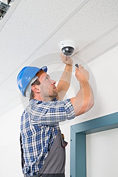 Technician adjusting cctv camera