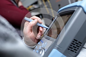 Technician with analyzer