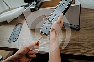 A technician assembles and installs smart electronic door lock for house protection