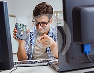 Technician with broken hard drive