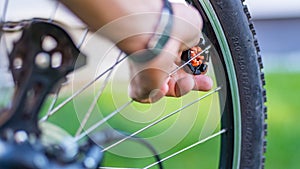 Technician centering bike wheel with dedicated spoke wrench