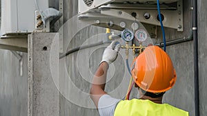 Technician is checking air conditioner