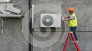 Technician is checking air conditioner