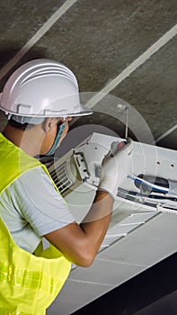 Technician is checking air conditioner