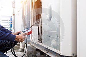 Technician is checking air conditioner