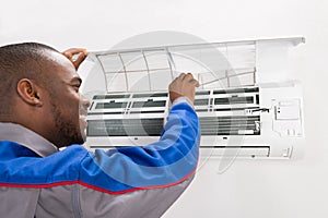 Technician Checking Air Conditioner
