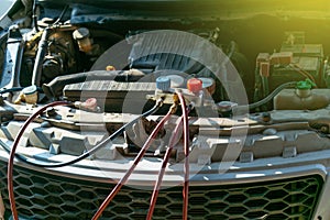 Technician checking air conditioner in engine room of eco car , cleaning air conditioner of car