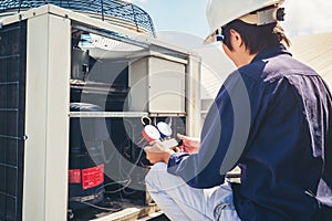 Technician is checking air conditioner photo