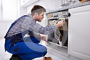 Technician Checking Dishwasher