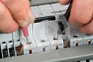 Technician checking fuse