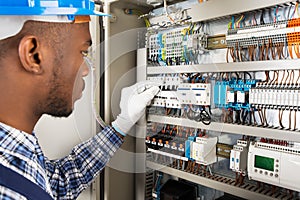 Technician Checking Fusebox