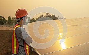 Technician checking the panel in solar power station panels
