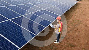 Technician checking the panel in solar power station panels