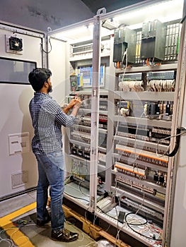 Technician checking and quality inspection of industrial panel