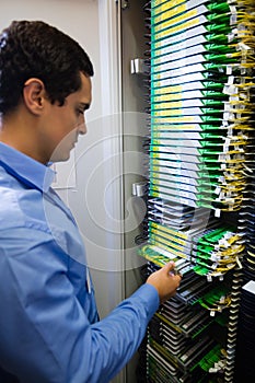 Technician checking routers