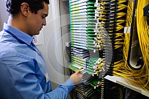 Technician checking routers