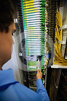 Technician checking routers