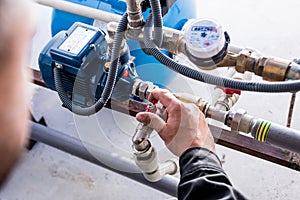 Technician checking water system nodes.Modern Industrial background