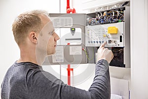 Technician checks fire panel in data center