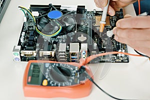 A technician checks the serviceability of the computer