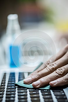 Technician cleaning computer hardware