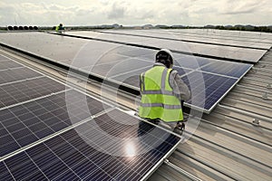 Technician Connecting Cable Solar Rooftop