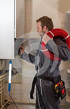 Technician controlling the heating system