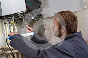 Technician controlling the heating system