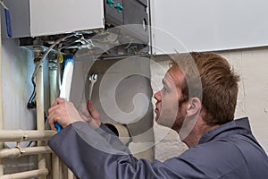 Technician controlling the heating system