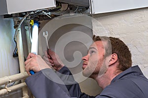 Technician controlling the heating system