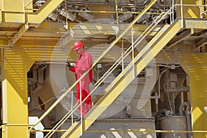 Technician controlling industrial process