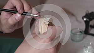 Technician dentist makes a jaw prosthetic