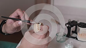 Technician dentist makes a jaw prosthetic