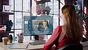 Technician employs AI chatbot on pc monitor and executing programming code