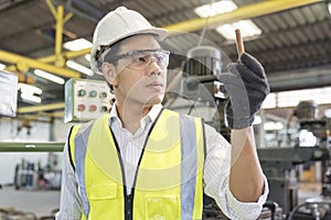 A technician or engineer is inspecting copper pipes in the refrigeration industry