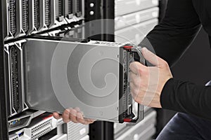 IT Engineer insert a Blade Server in Data Center photo