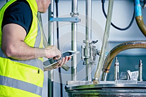 Technician engineer male worker working in boiler room gas pipe checking service routine in industry factory