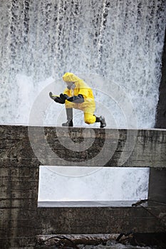 Technician examining toxic substance in contaminated area