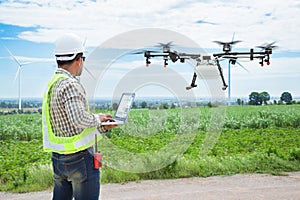 Technician farmer use wifi computer control agriculture drone