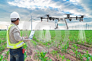 Technician farmer use wifi computer control agriculture drone