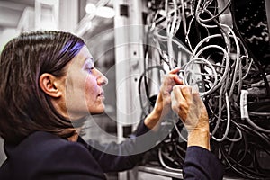 Technician fixing cable