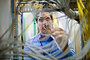 Technician fixing cable