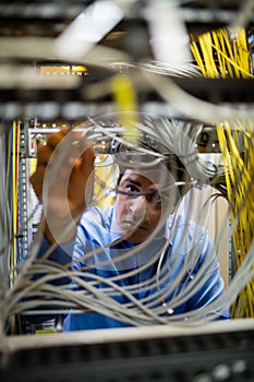 Technician fixing cable