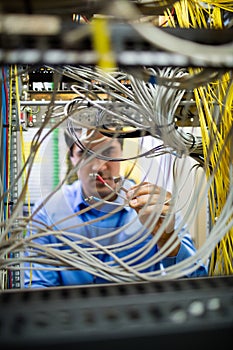 Technician fixing cable