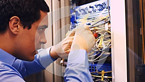 Technician fixing cable