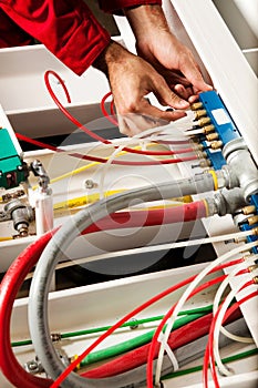 Technician fixing cabling and wiring circuit