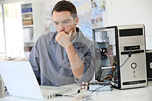Technician fixing the computer